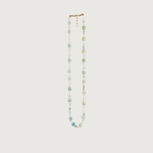 The Aviv necklace has a mixture of AA-grade beryl, Zircon crystal, and petite freshwater pearls, with a 14-karat gold closure and extender. 16” chain length